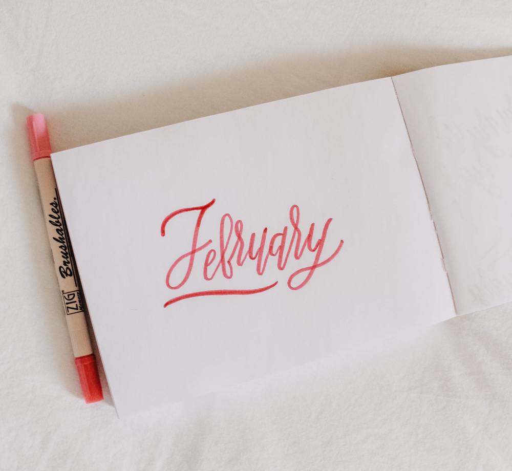 february written on a notepad 