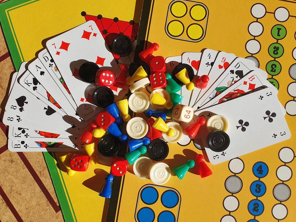 cards, dice, game pieces on board game