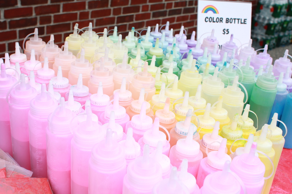 bottles of rainbow color paint