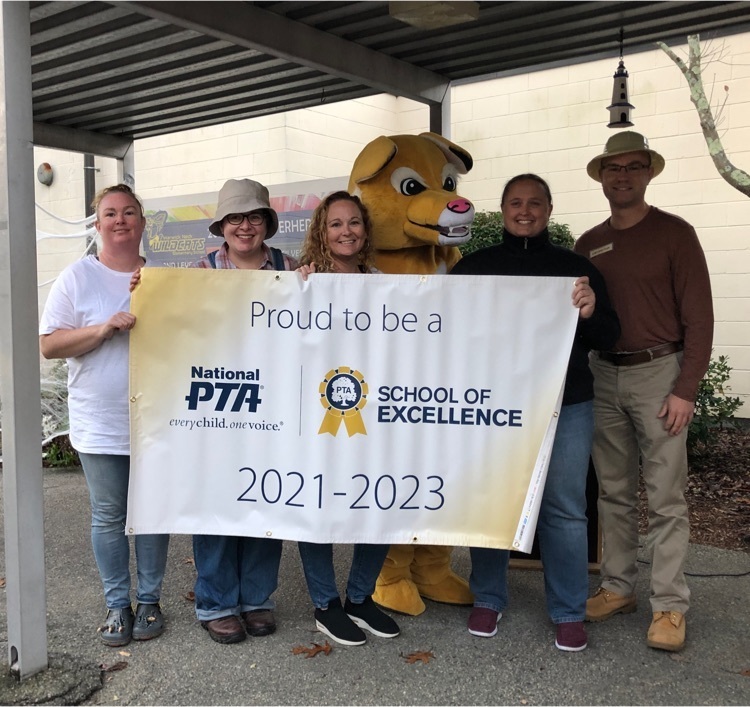 pta members holding excellence award banner 