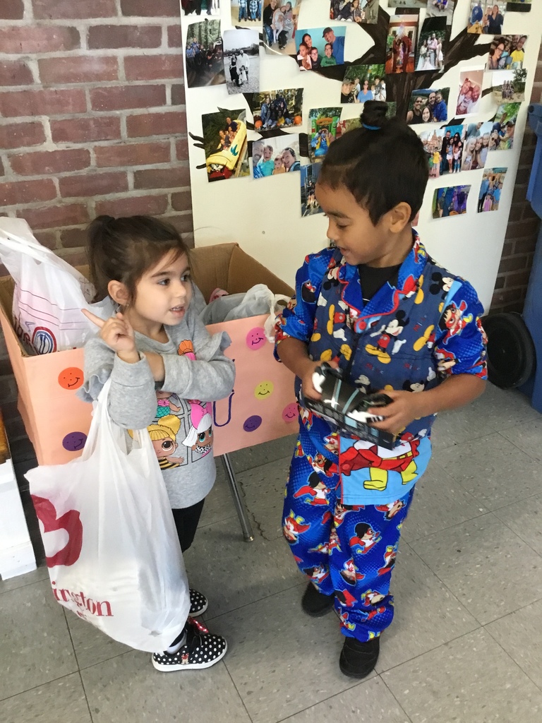 Two students dropping off their donations.