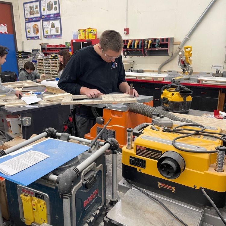 student working with saw